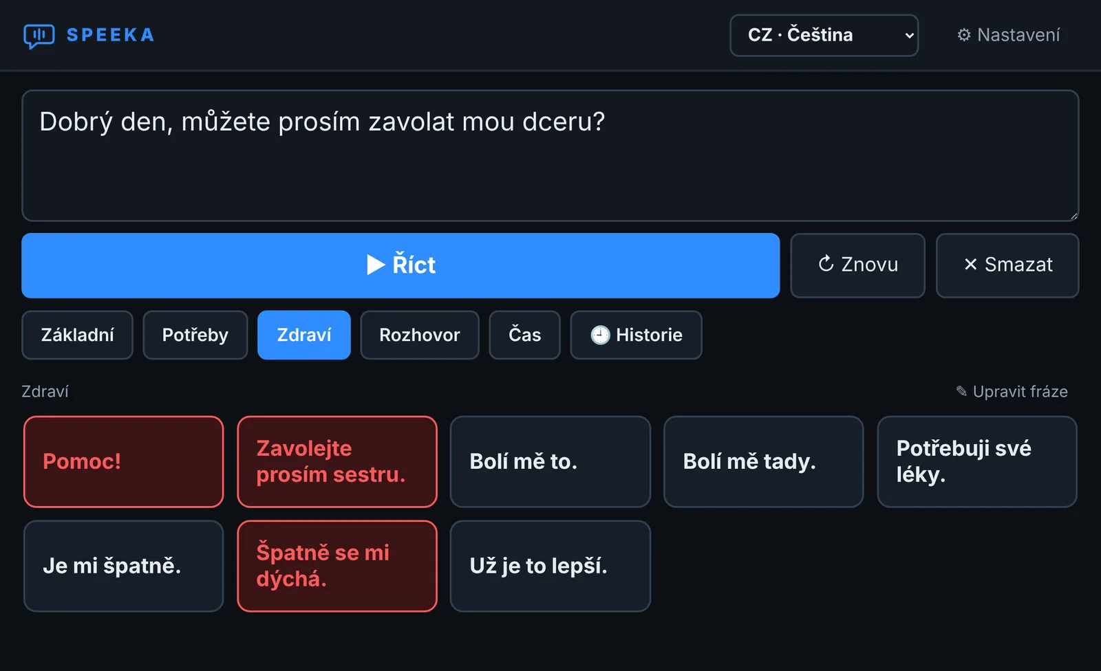 Okno aplikace Speeka: nahoře pole pro text a velké modré tlačítko Říct, pod ním skupiny frází a tlačítka s frázemi, naléhavé červeně.